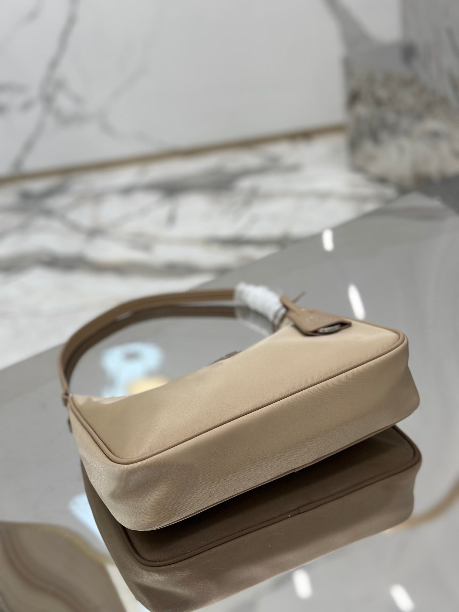 Bolsa Prada mini Re-Edition 2000