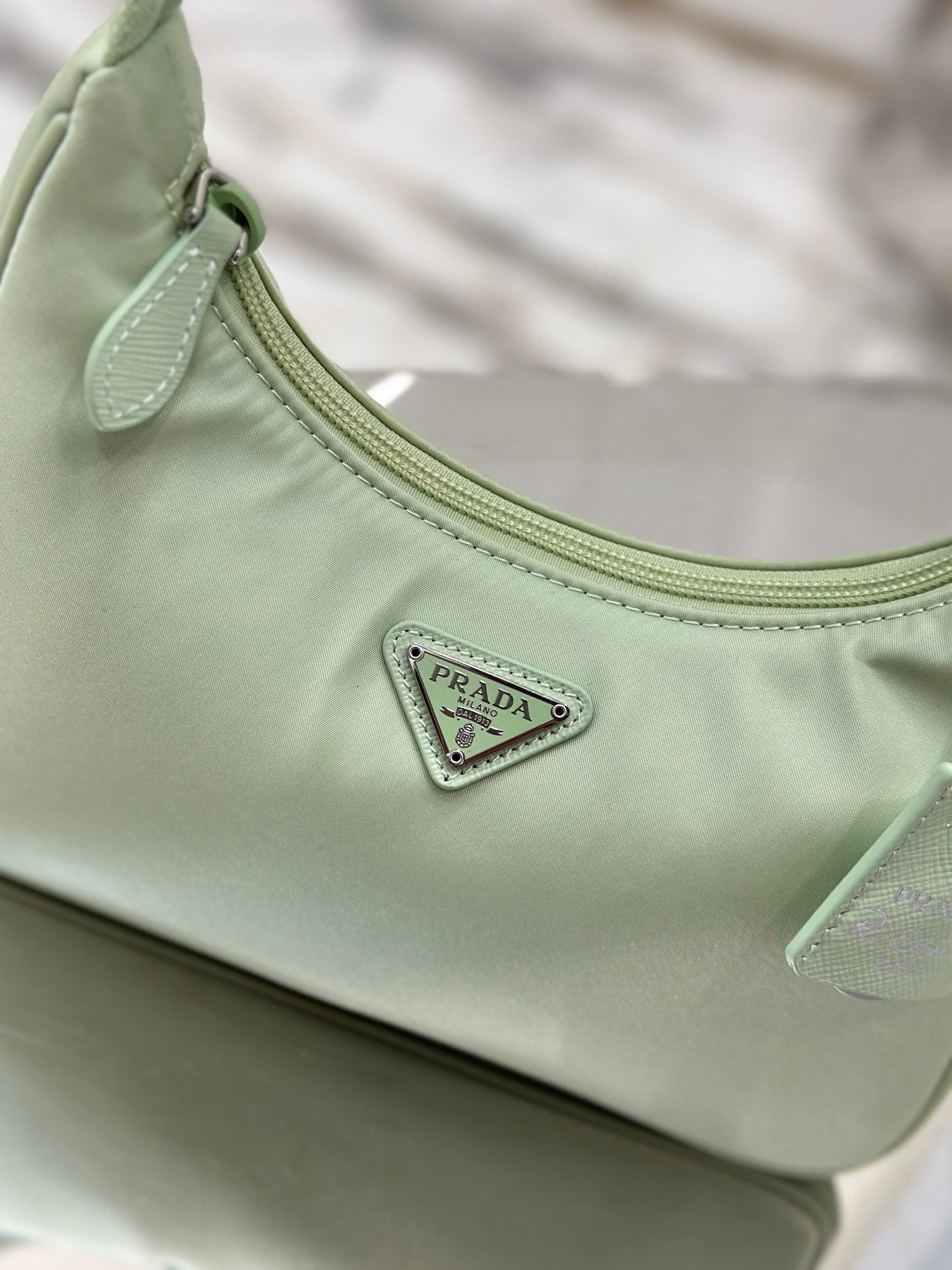 Bolsa Prada mini Re-Edition 2000
