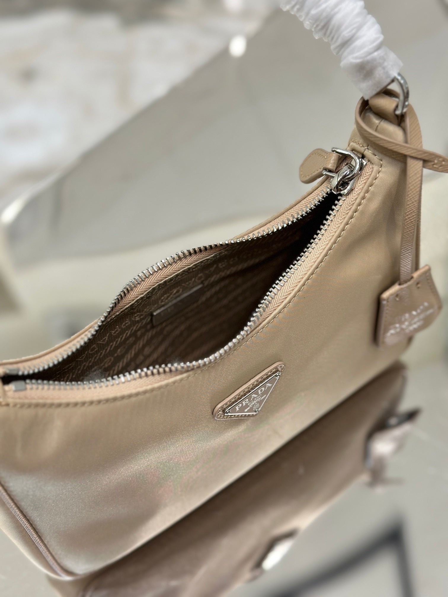 Bolsa Prada mini Re-Edition 2000