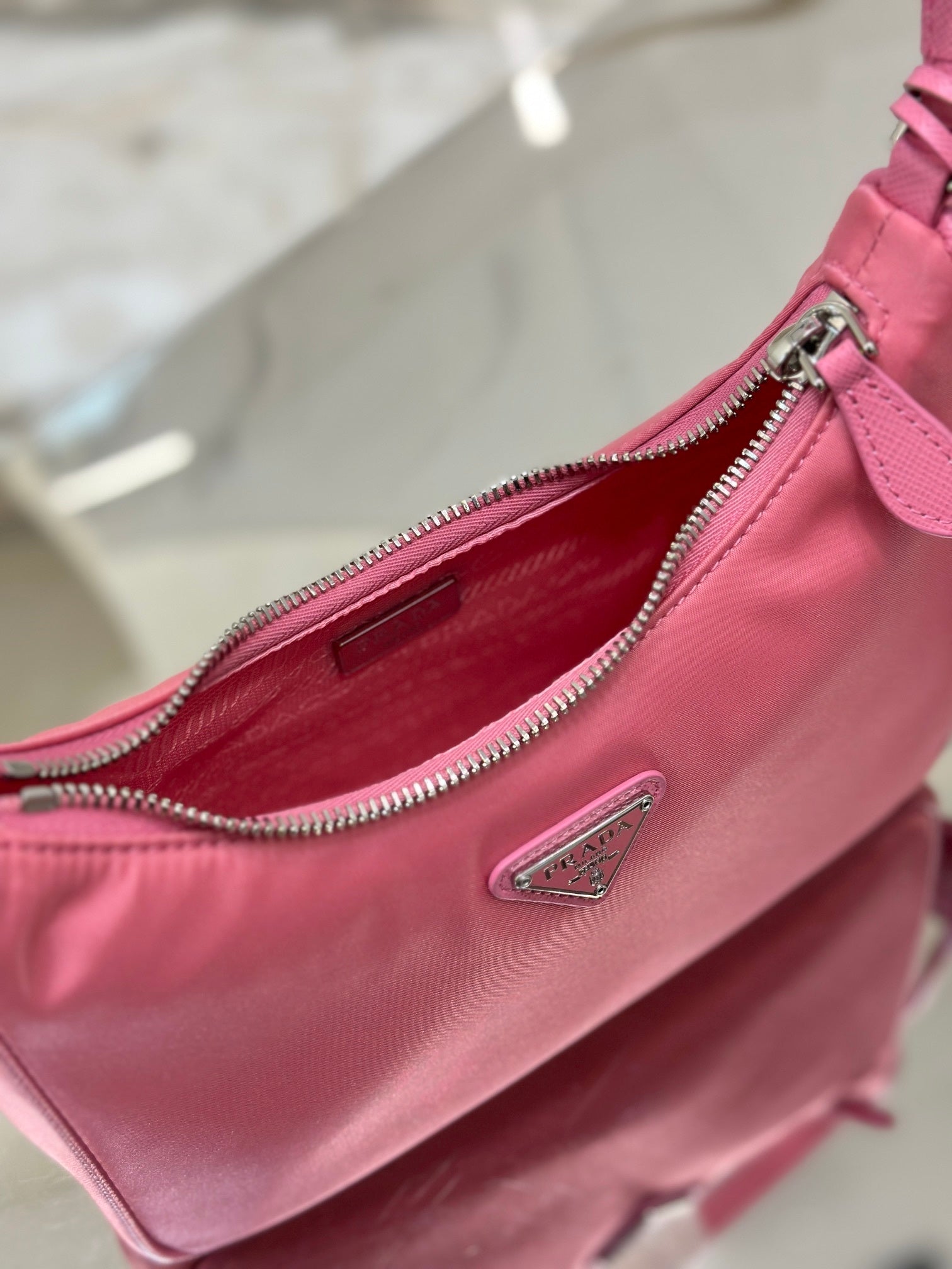 Bolsa Prada mini Re-Edition 2000